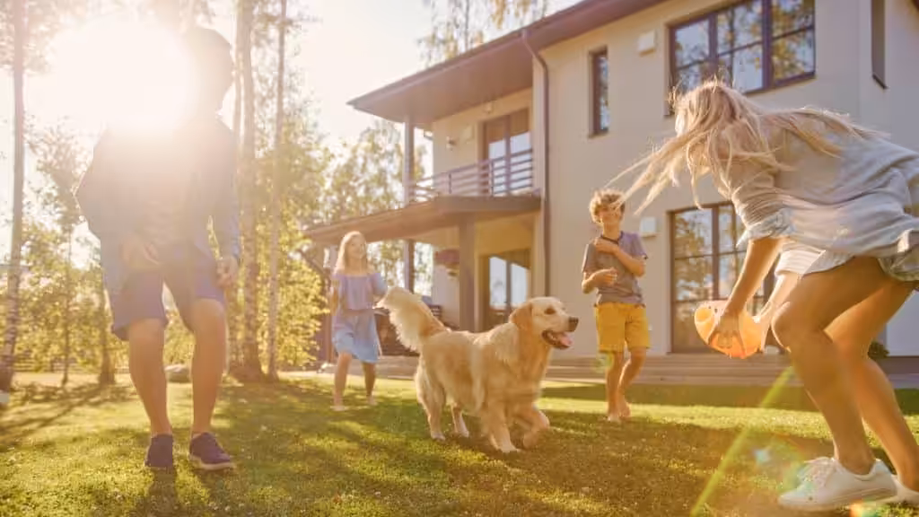 Family enjoying time at home with their dog and local cleaning professionals