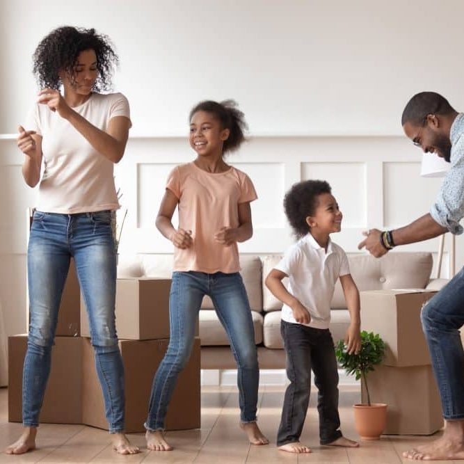 African couple kids celebrating relocation day dancing feels happy Move In Cleaning Services Cincinnati OH